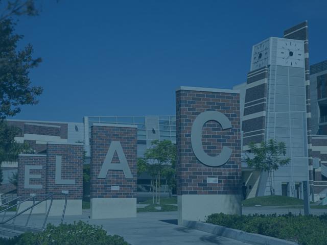 Signs in the shape of letters spell ELAC on a college campus.
