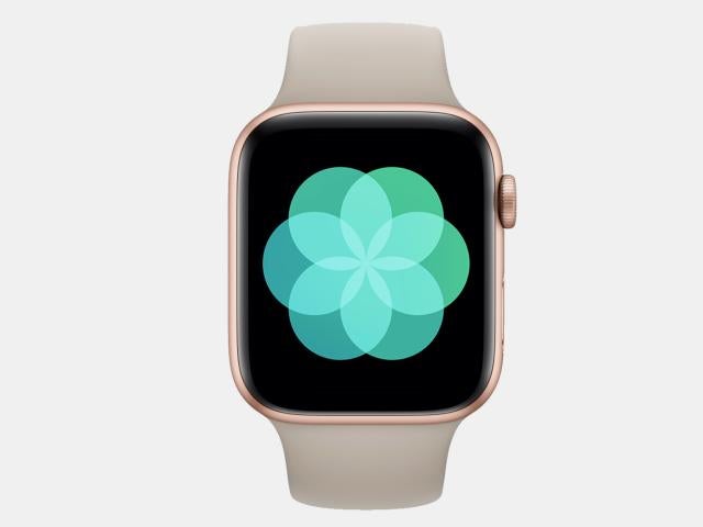 Product photo of Apple Watch with green floral graphic onscreen.