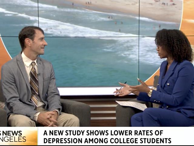 Eisenberg faces a CBS news anchor in-studio. 